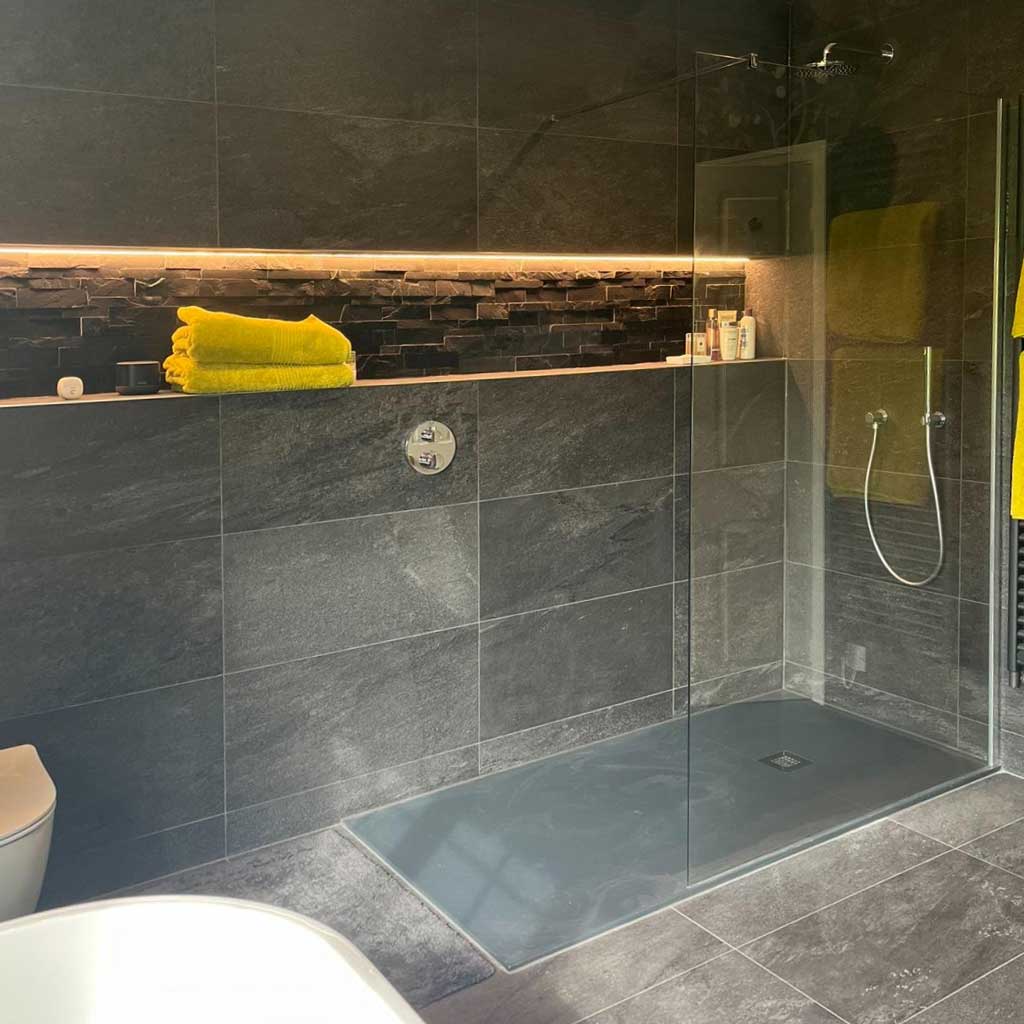 Completed bathroom redesign in Giggleswick, Settle, showing the Black Flair Gemstone shower tray to match black wall tiles.